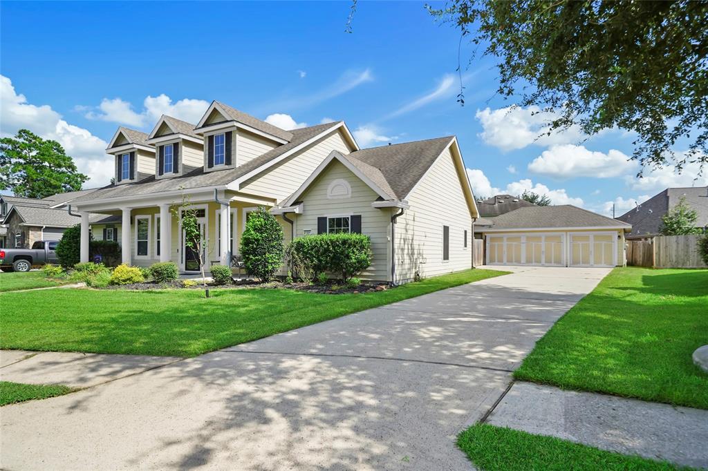 Single story David Weekley built home in Spring Trails with a 3 car detached garage.