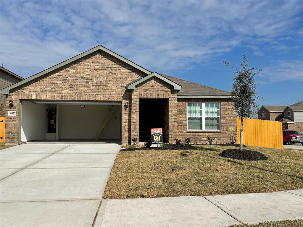 a front view of a house with yard