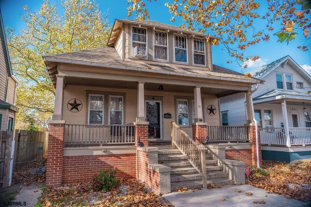 a front view of a house with a porch