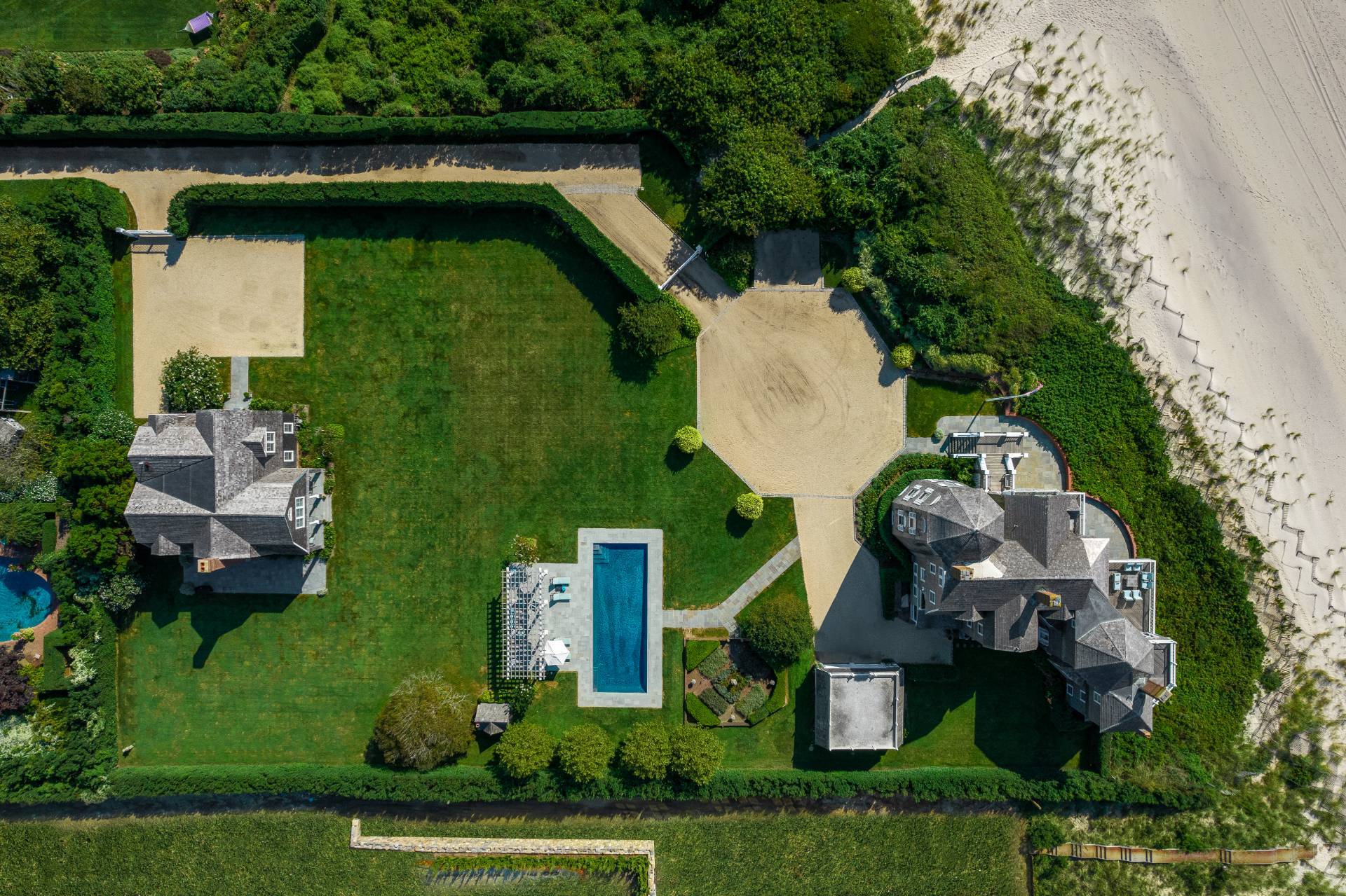 an aerial view of a house with outdoor space pool seating area and yard