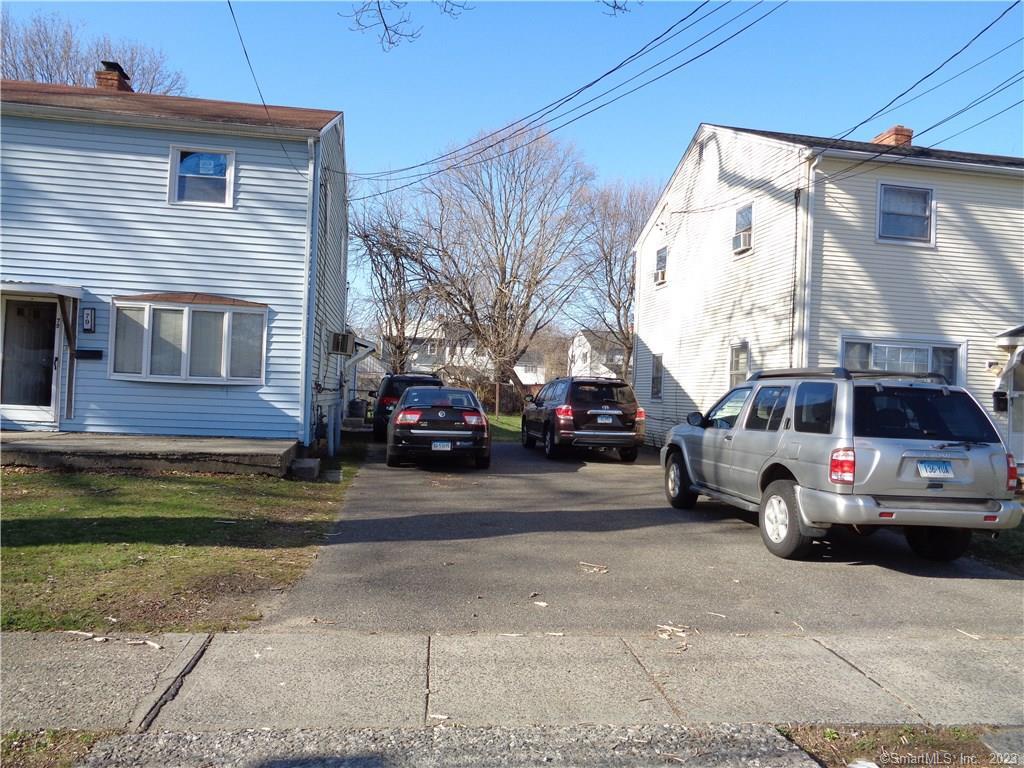 a view of a car parked in front of a house