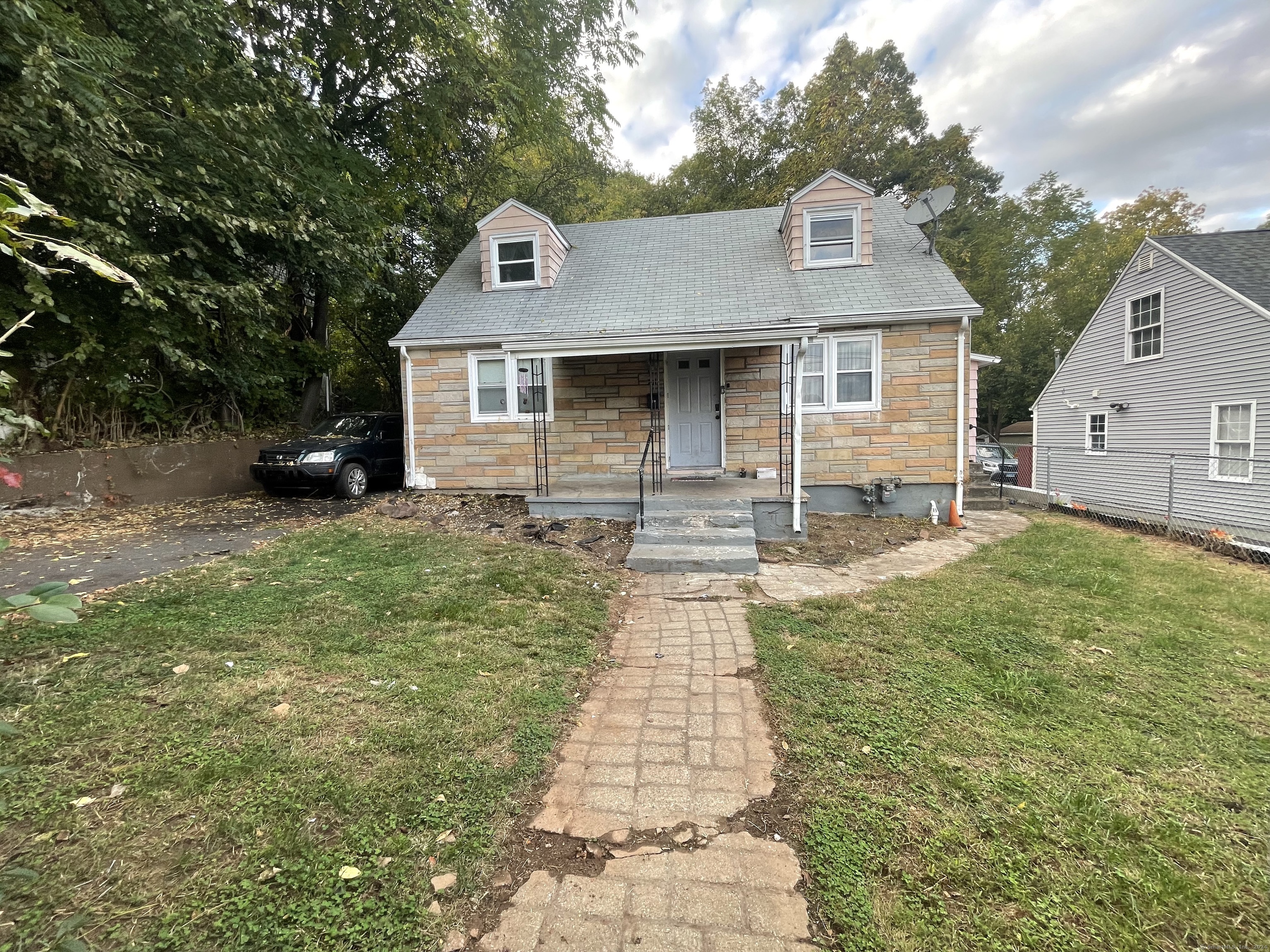 a front view of a house with yard