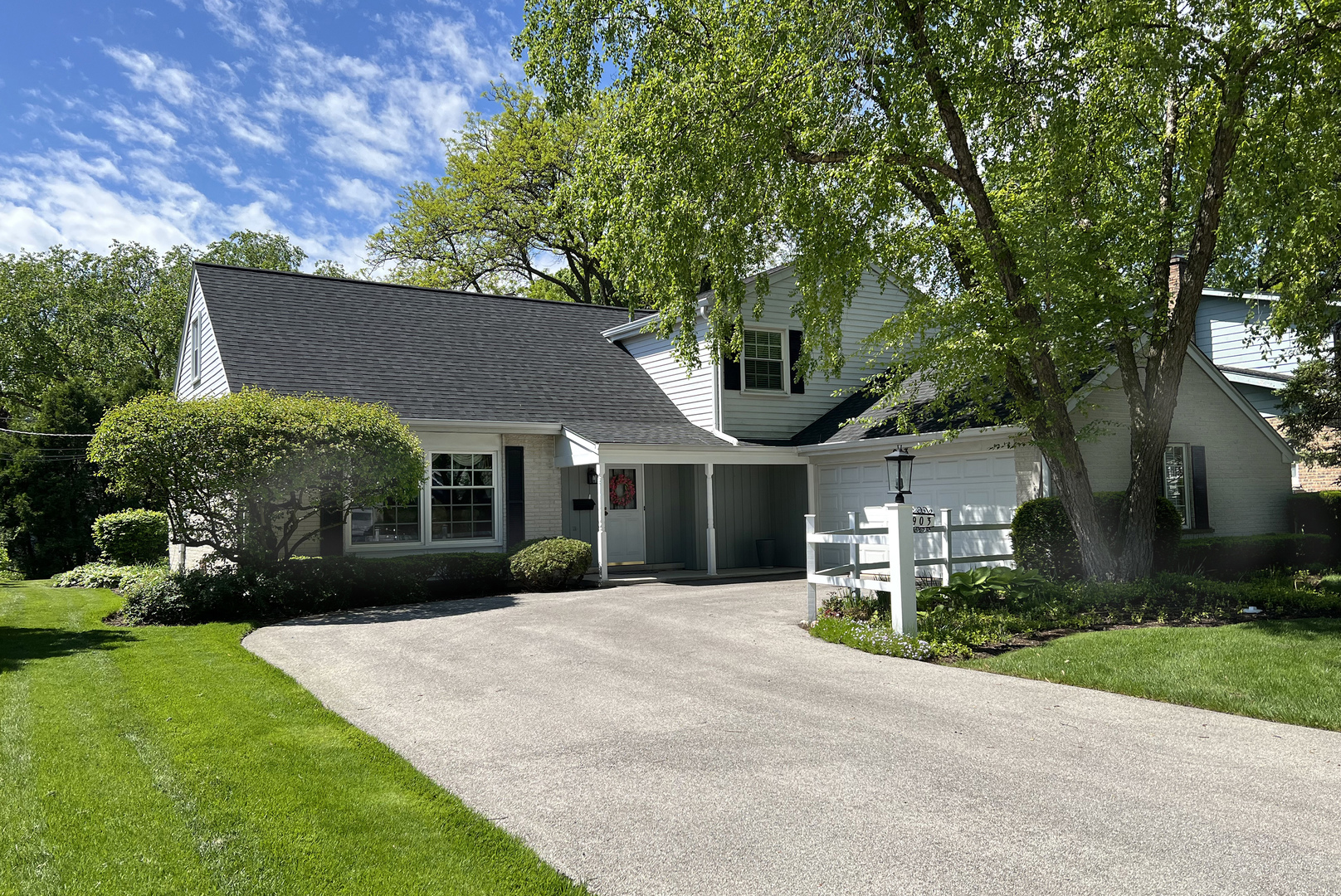 front view of a house with a yard