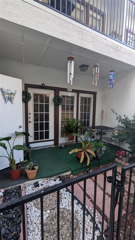 a front view of a house with garden and porch