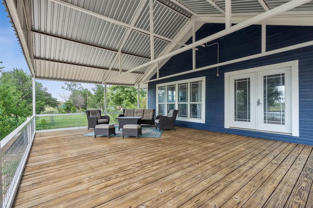 a view of a house with sitting area and wooden floor