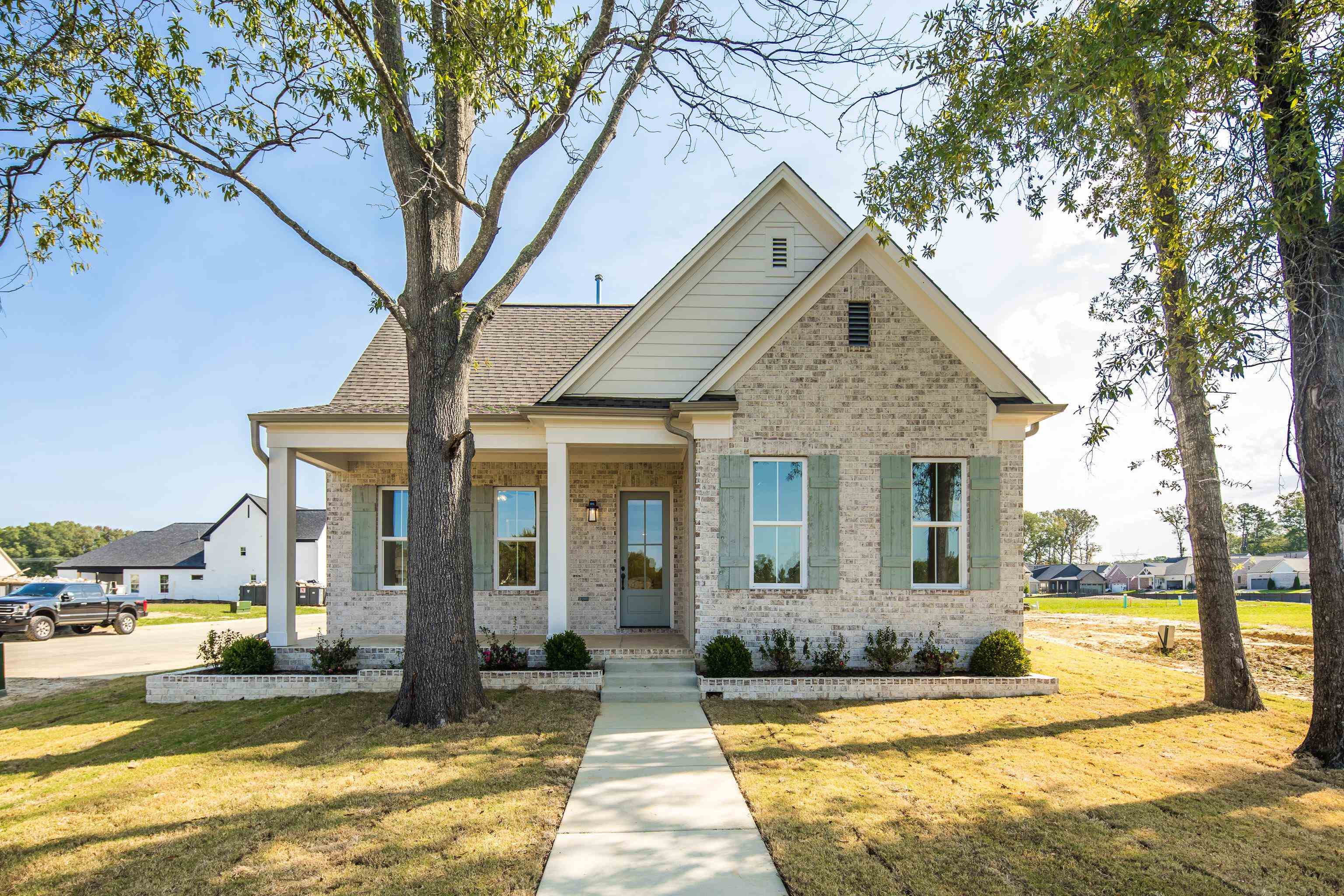 a front view of a house with a yard