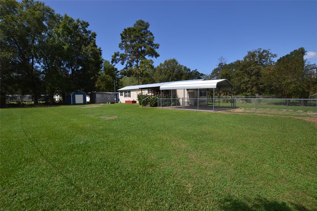 a view of a house with a big yard