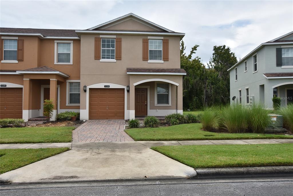 a front view of a house with a yard