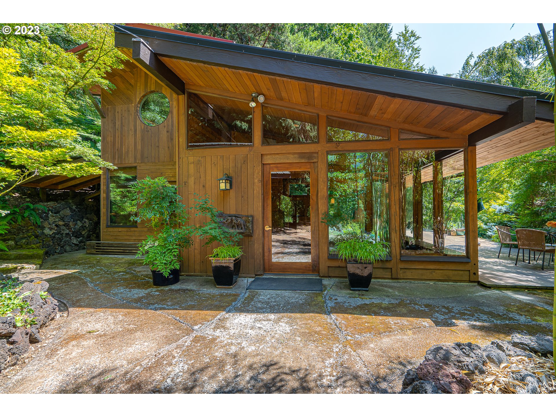 a front view of a house with garden