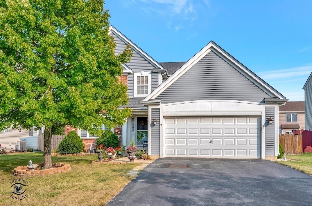 a front view of a house with a garage