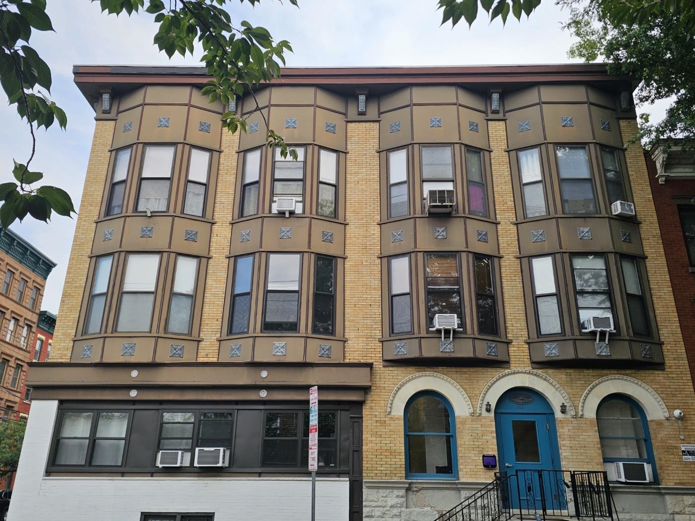 a front view of a building with a lot of windows