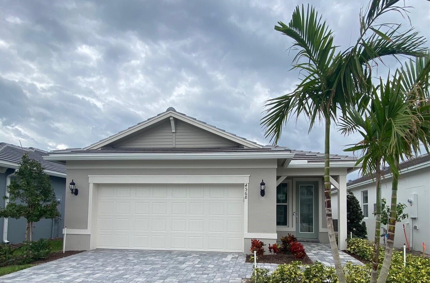 a front view of a house with a garage