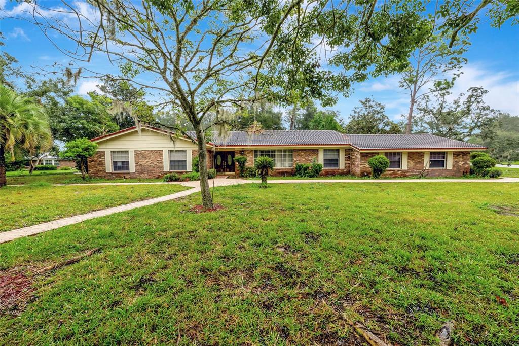 a view of a house with a big yard