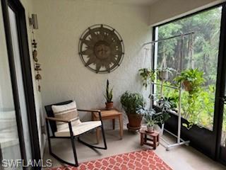 a room with furniture and a potted plant