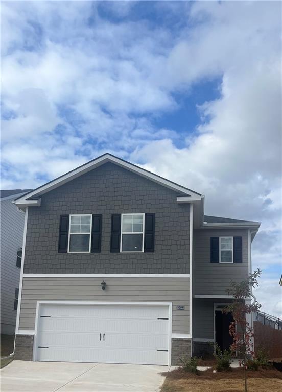 a front view of a house with a garage