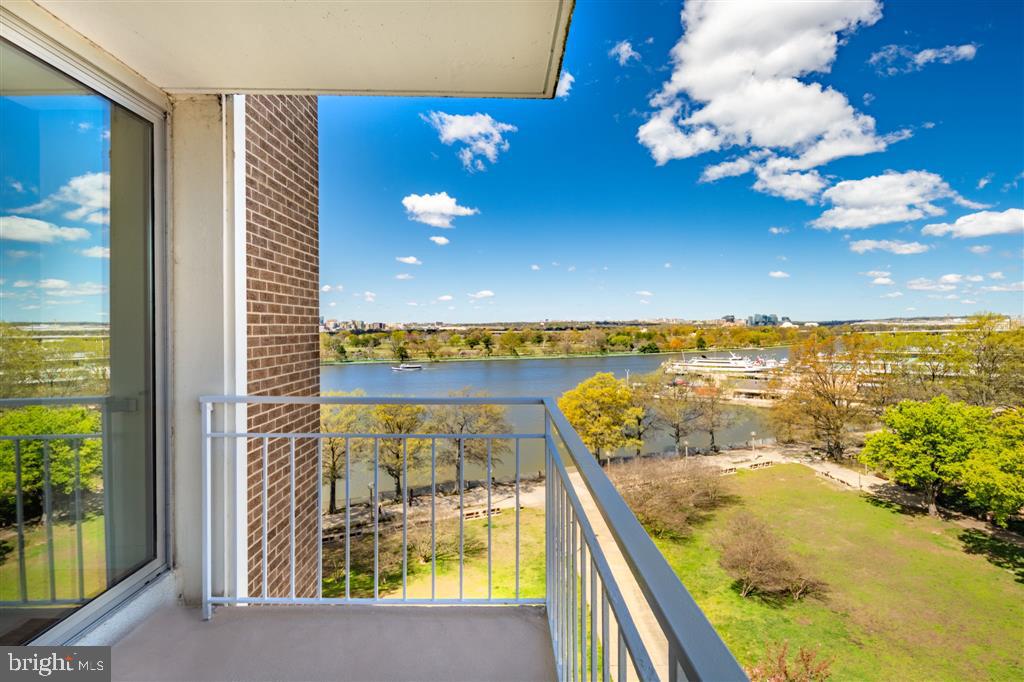 a view of a balcony with ocean view