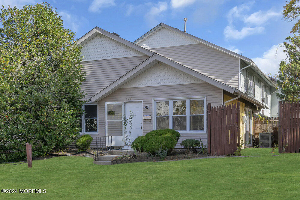 a front view of a house with a yard and porch