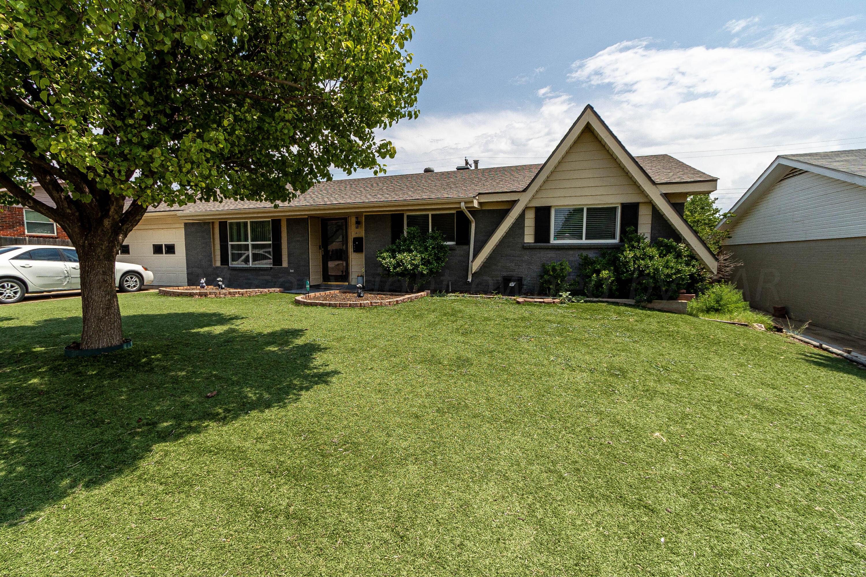 front view of a house with a yard