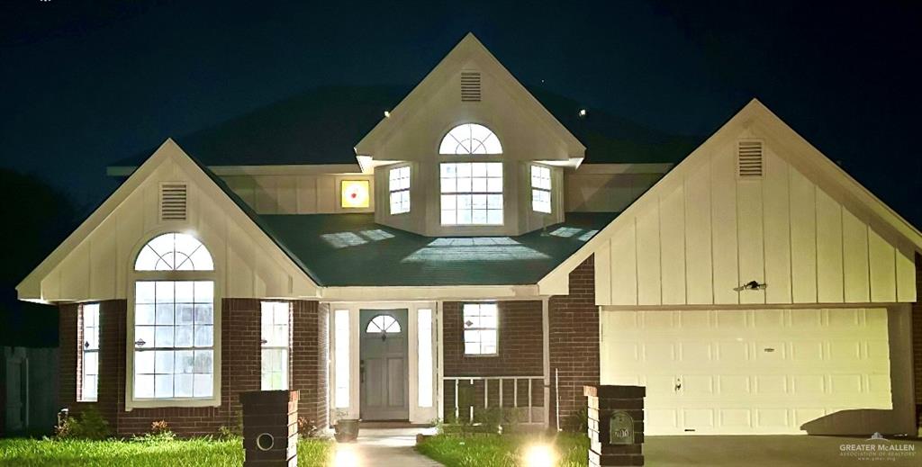 a view of a brick house with a large windows