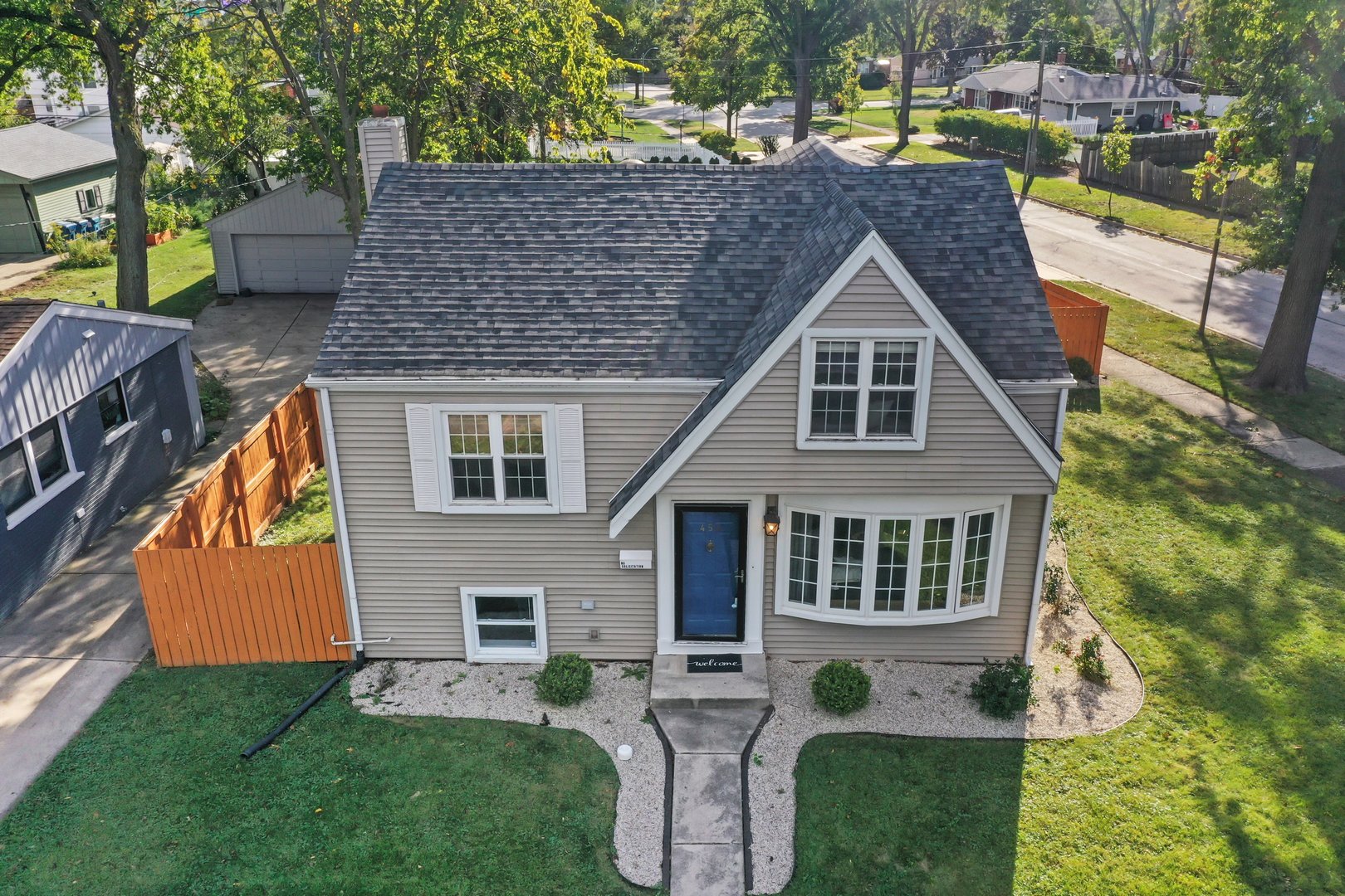 a aerial view of a house with a yard