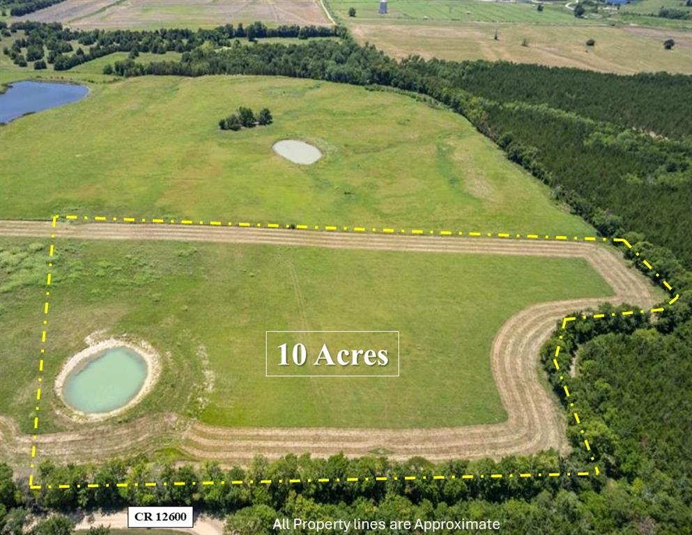 an aerial view of a residential houses with outdoor space and swimming pool