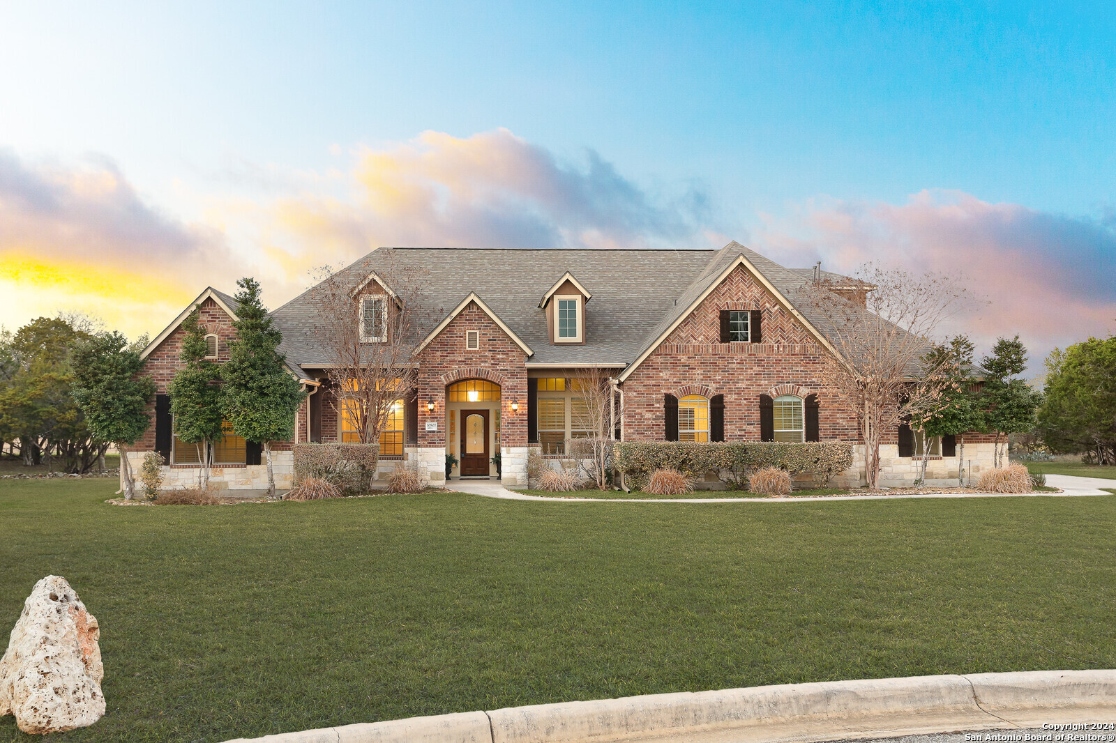 a front view of a house with garden