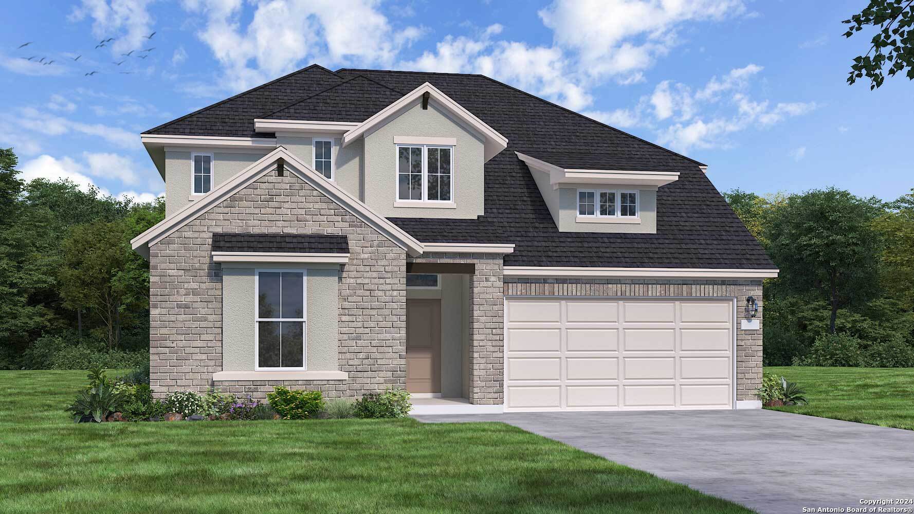 a front view of a house with a yard and garage