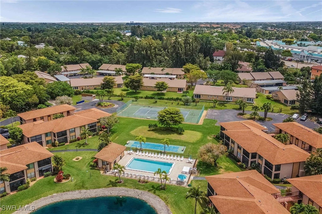 an aerial view of multiple houses with yard