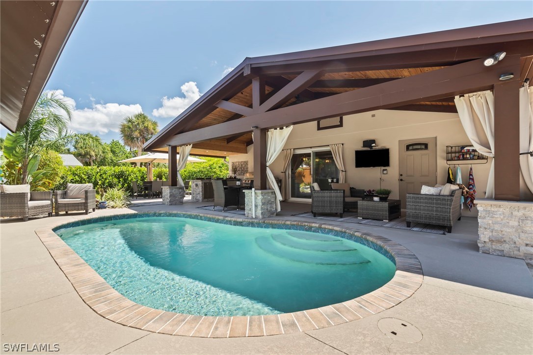 a view of a swimming pool with a patio