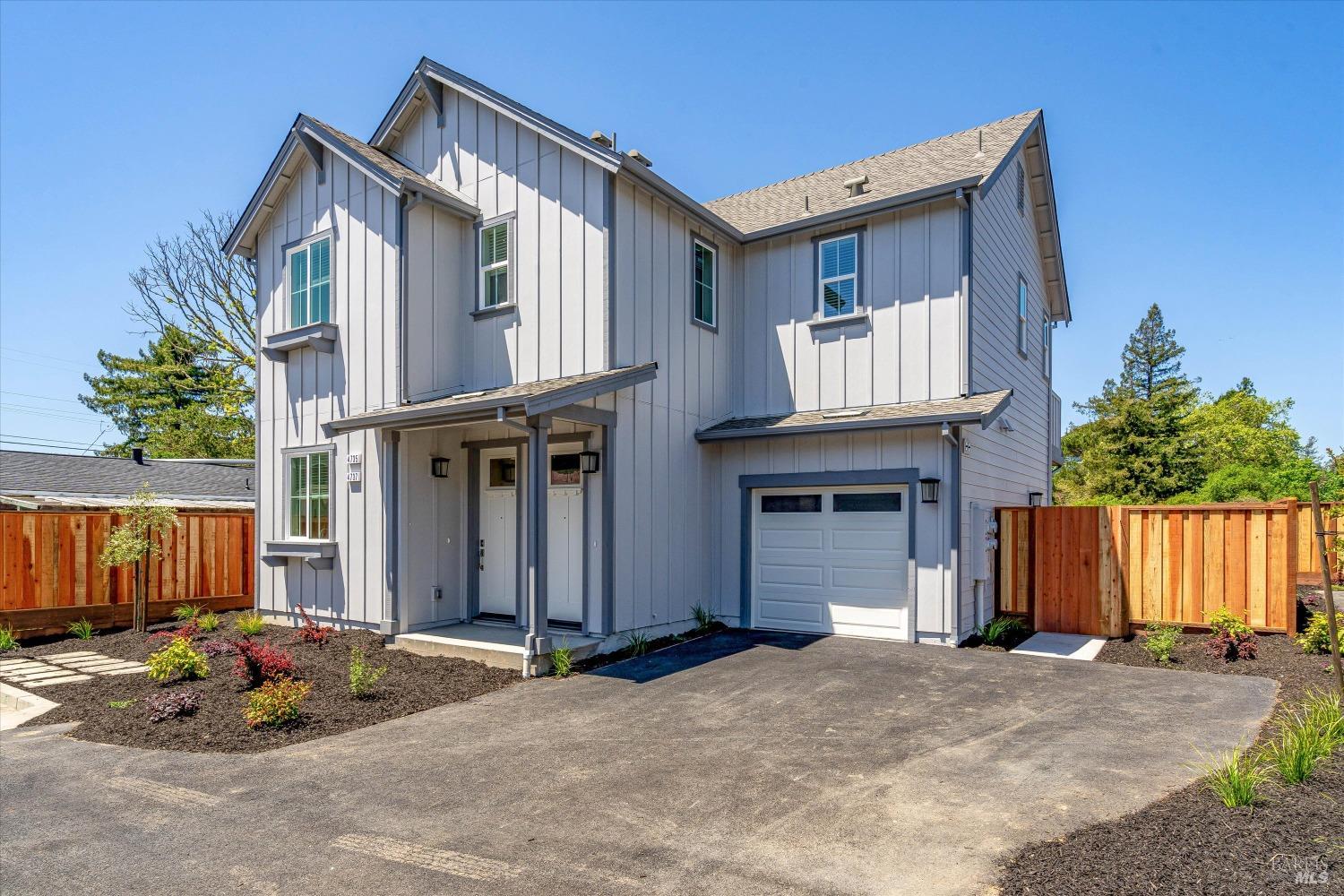 a front view of a house with parking space