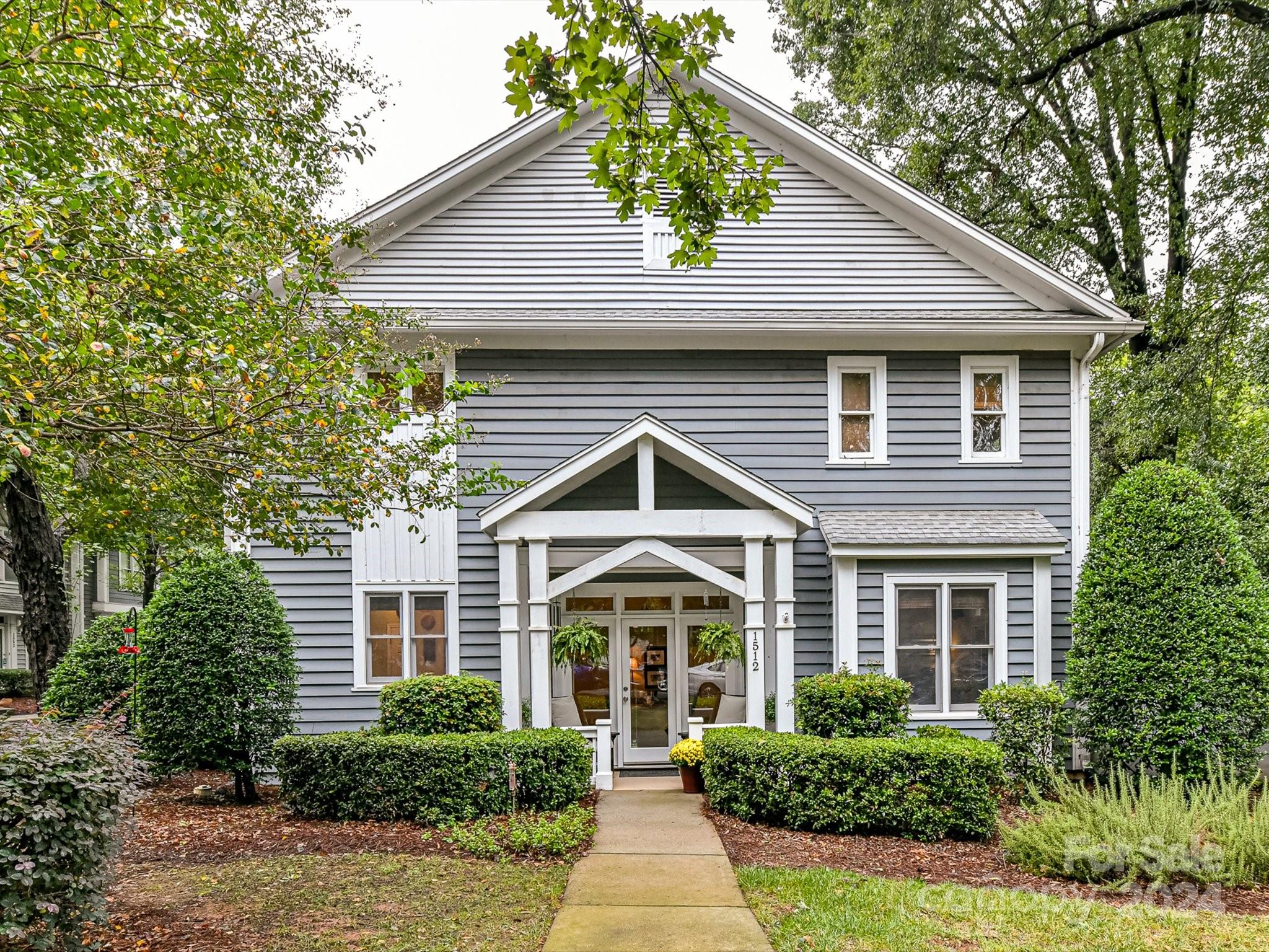 a front view of a house with yard