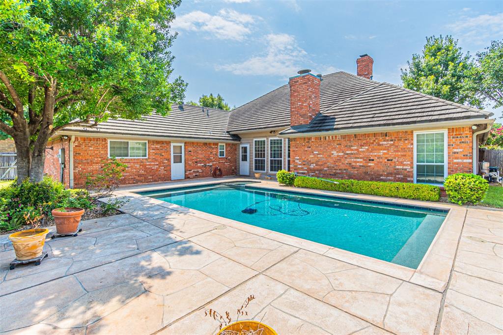 a view of swimming pool with outdoor seating