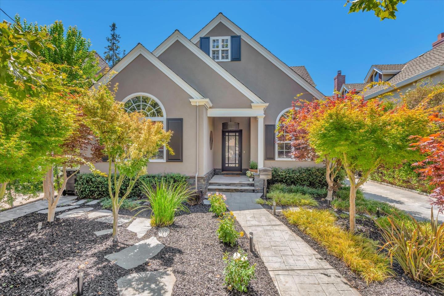 a front view of a house with garden