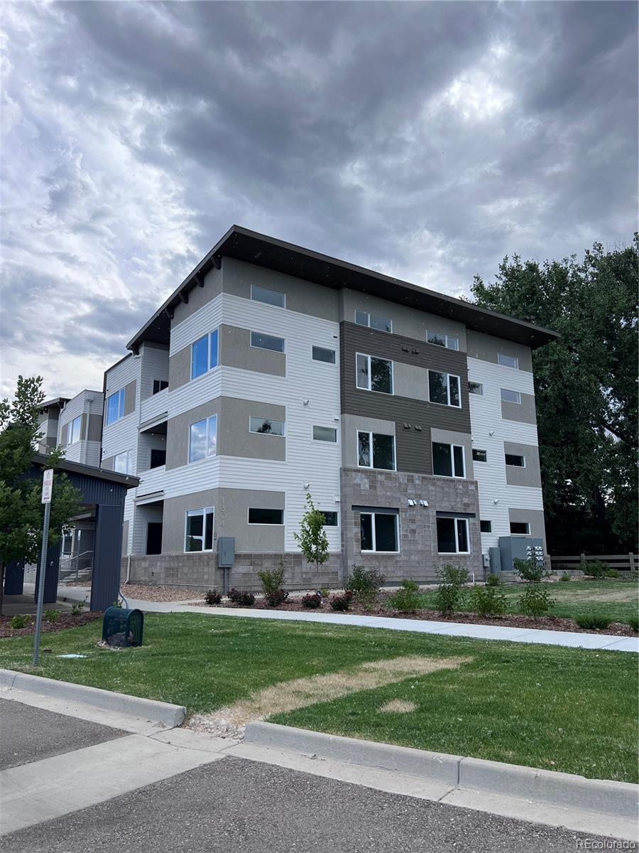 a front view of building with yard