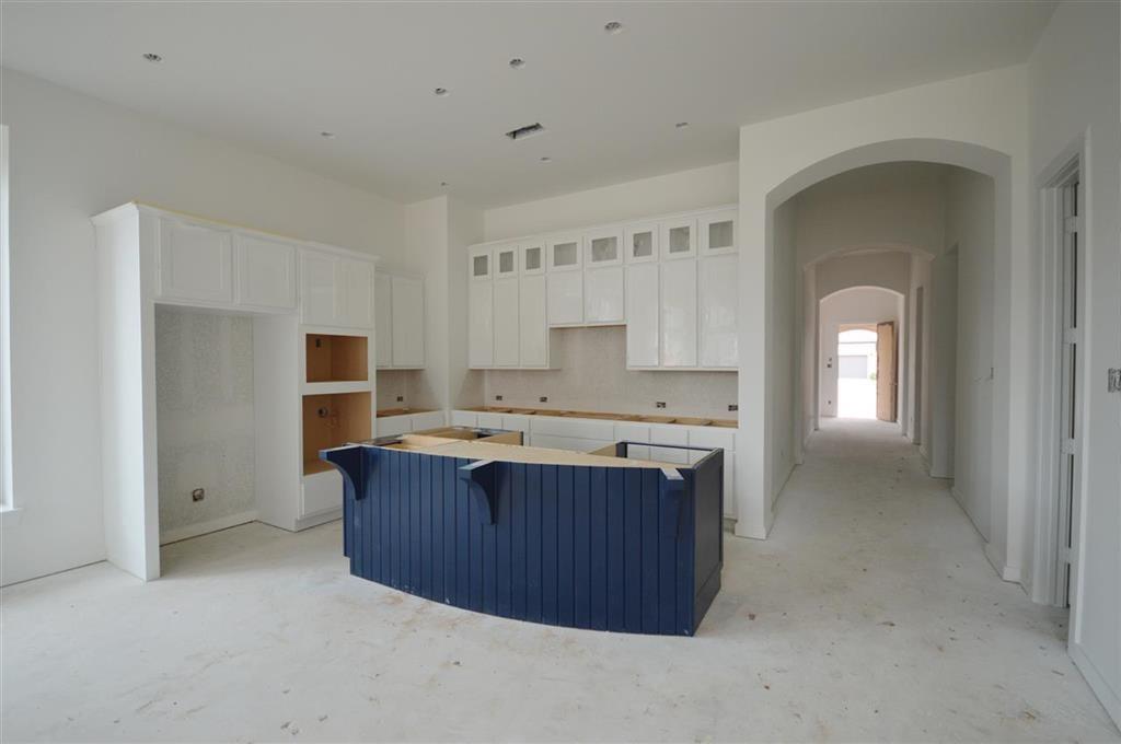 a view of kitchen with a sink cabinets and wooden floor