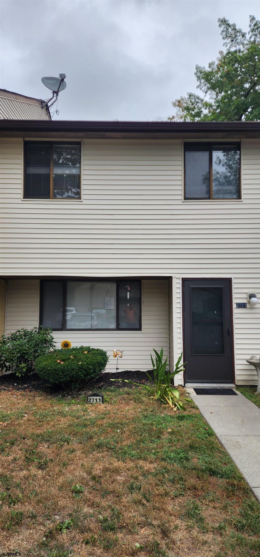 a front view of a house with garage