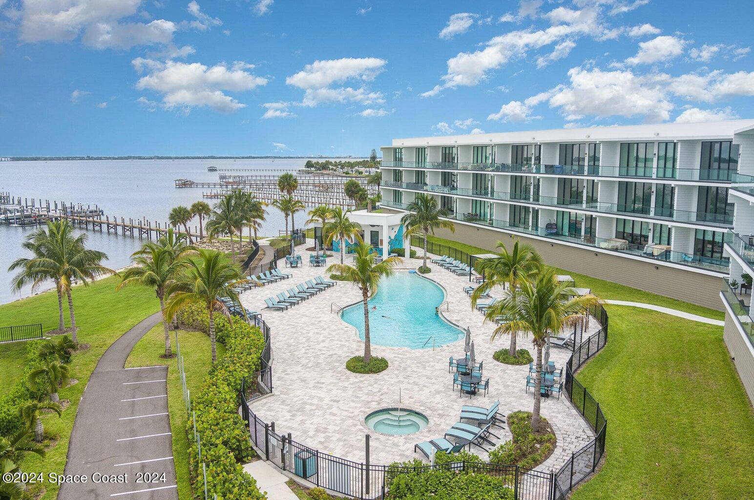 a view of swimming pool with outdoor seating