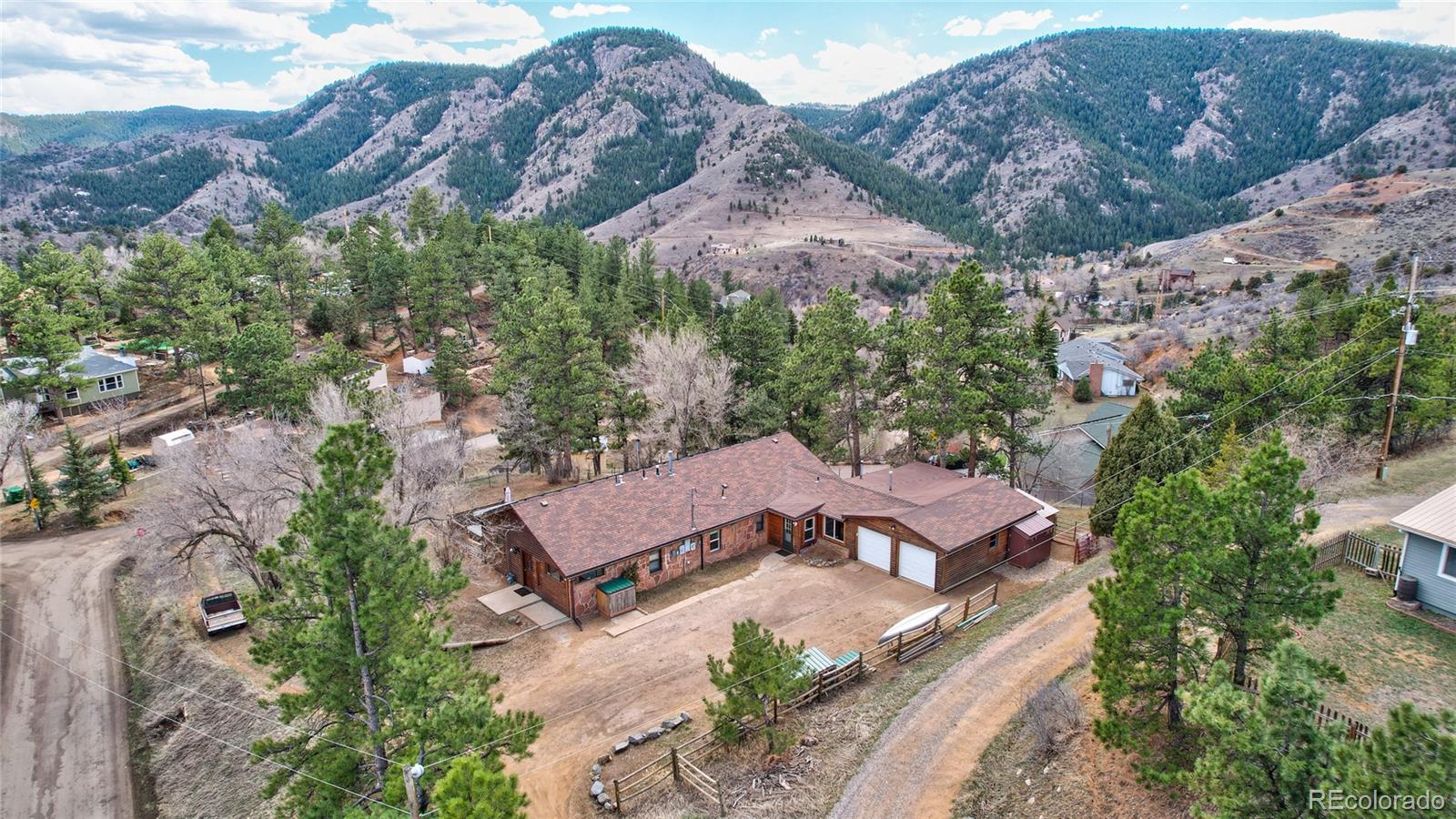 an aerial view of house with mountain view