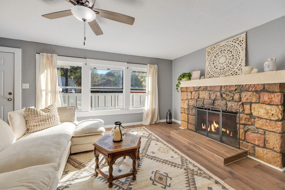 a living room with furniture and a fireplace