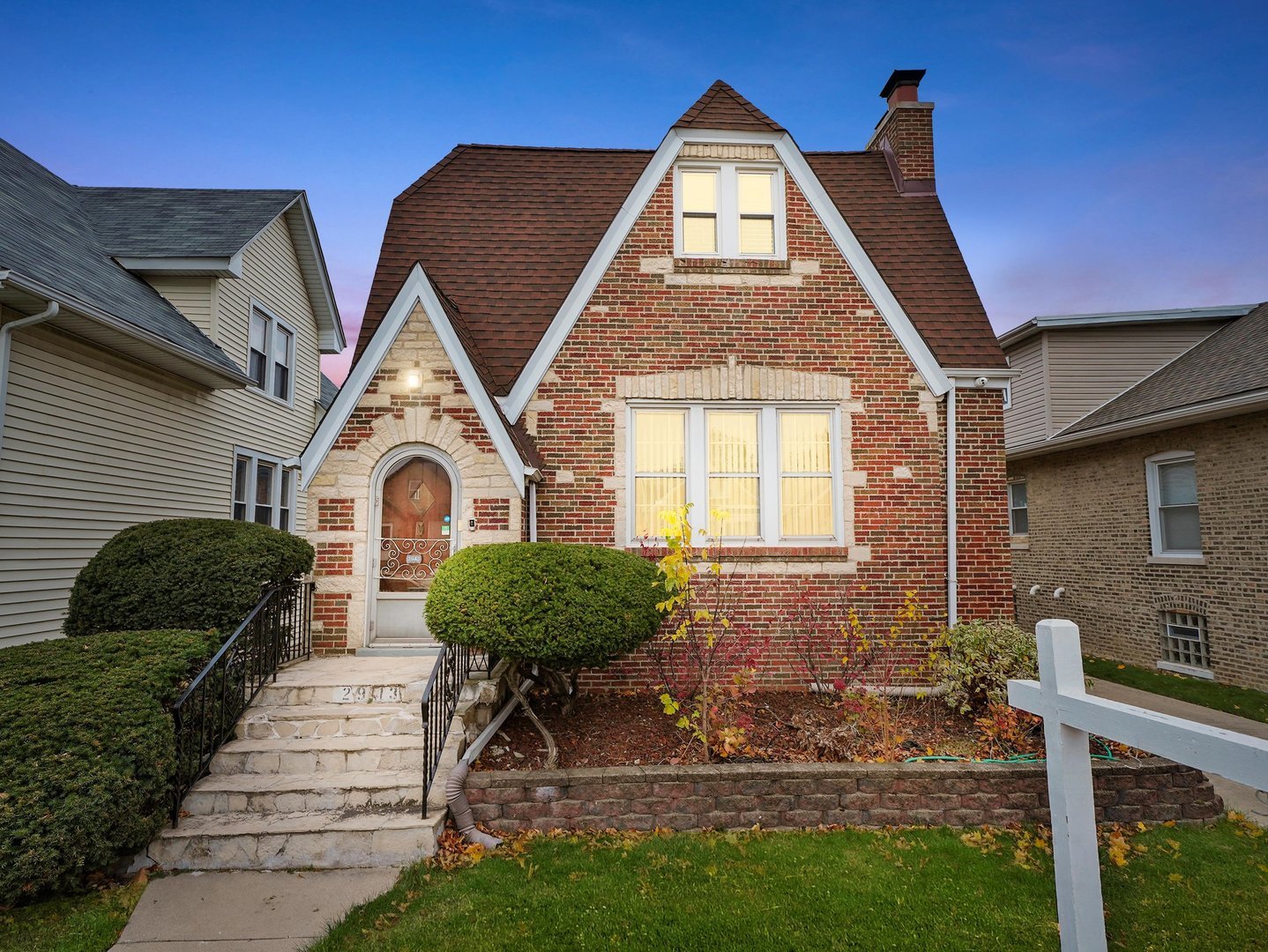 a front view of a house with garden