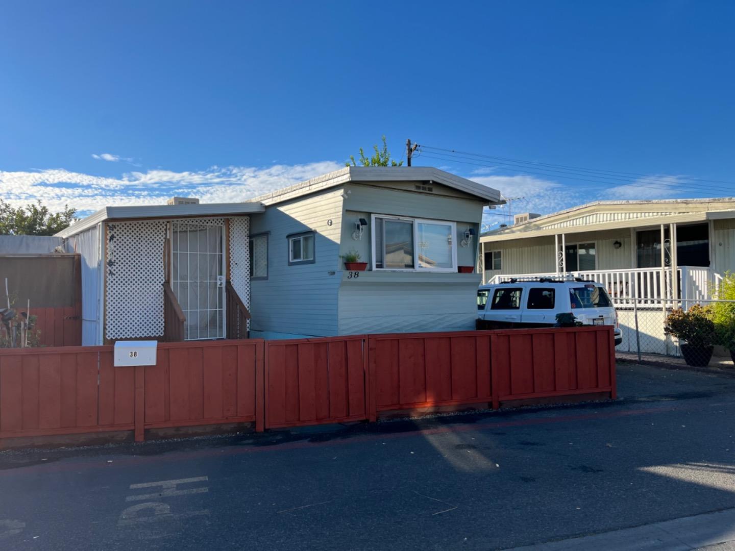 a front view of a house with parking space