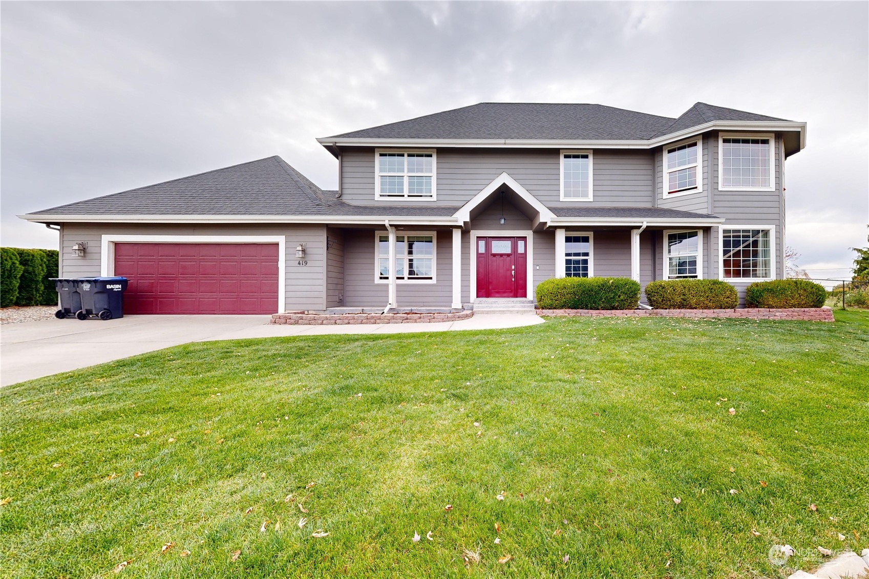 a front view of house with yard and green space