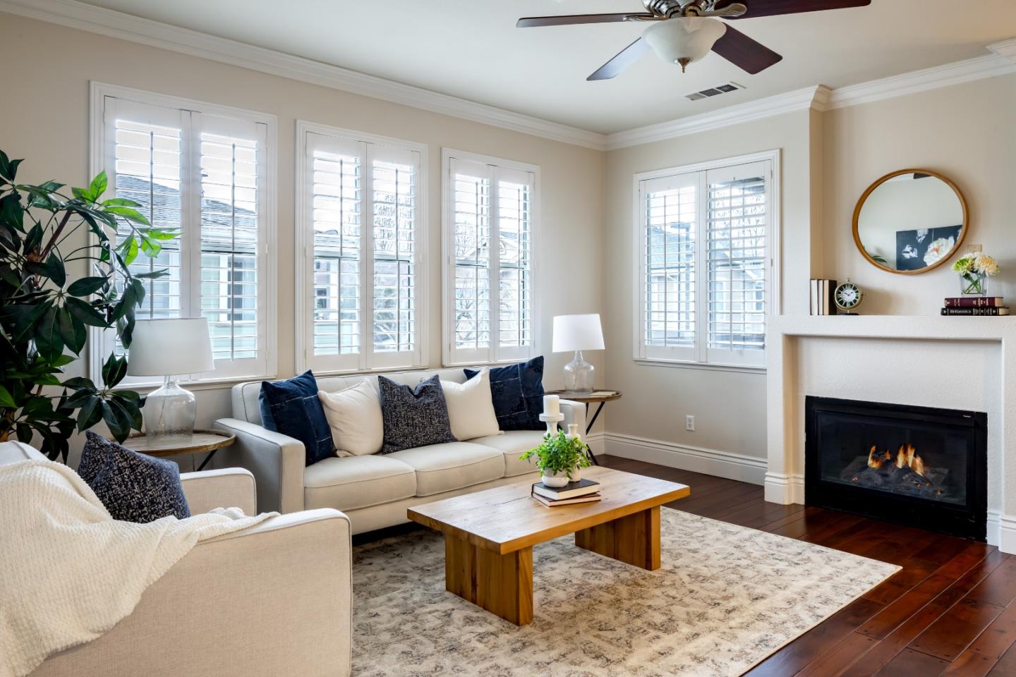 a living room with furniture a window and a fireplace