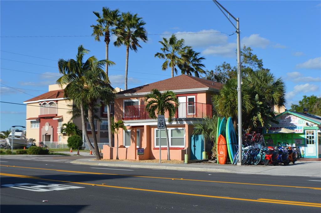 a view of street with small shops