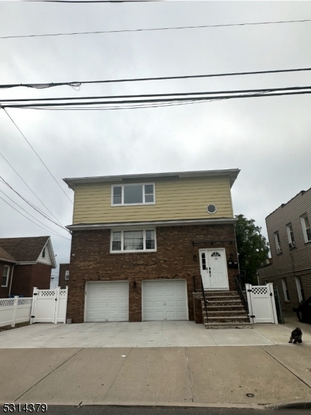 a front view of a house with a garage