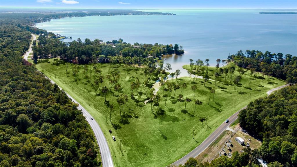 a view of a lake with a yard