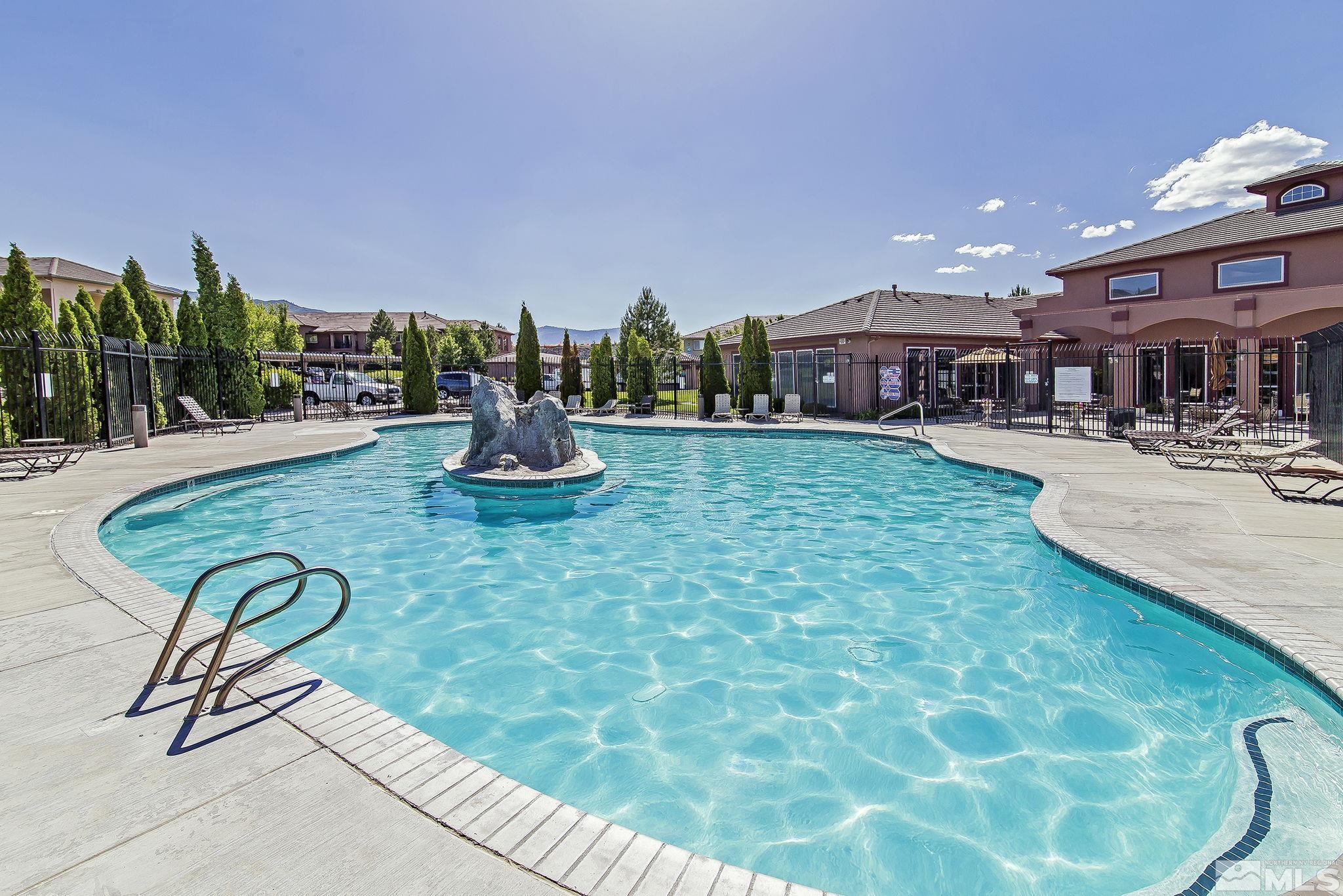 a view of a swimming pool with a patio