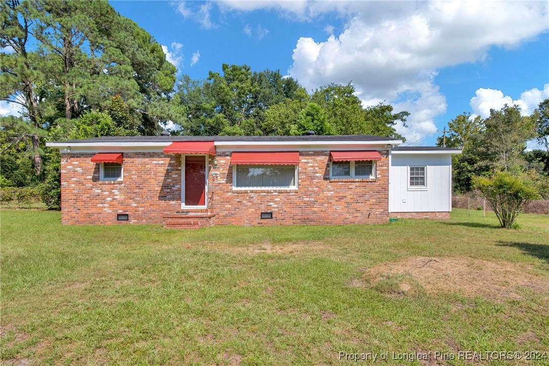 a view front of house with backyard and garden