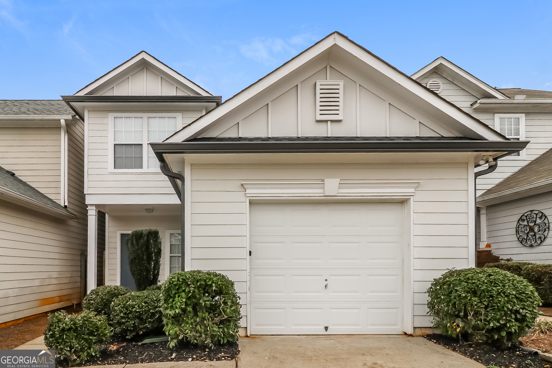 a front view of a house with a garage