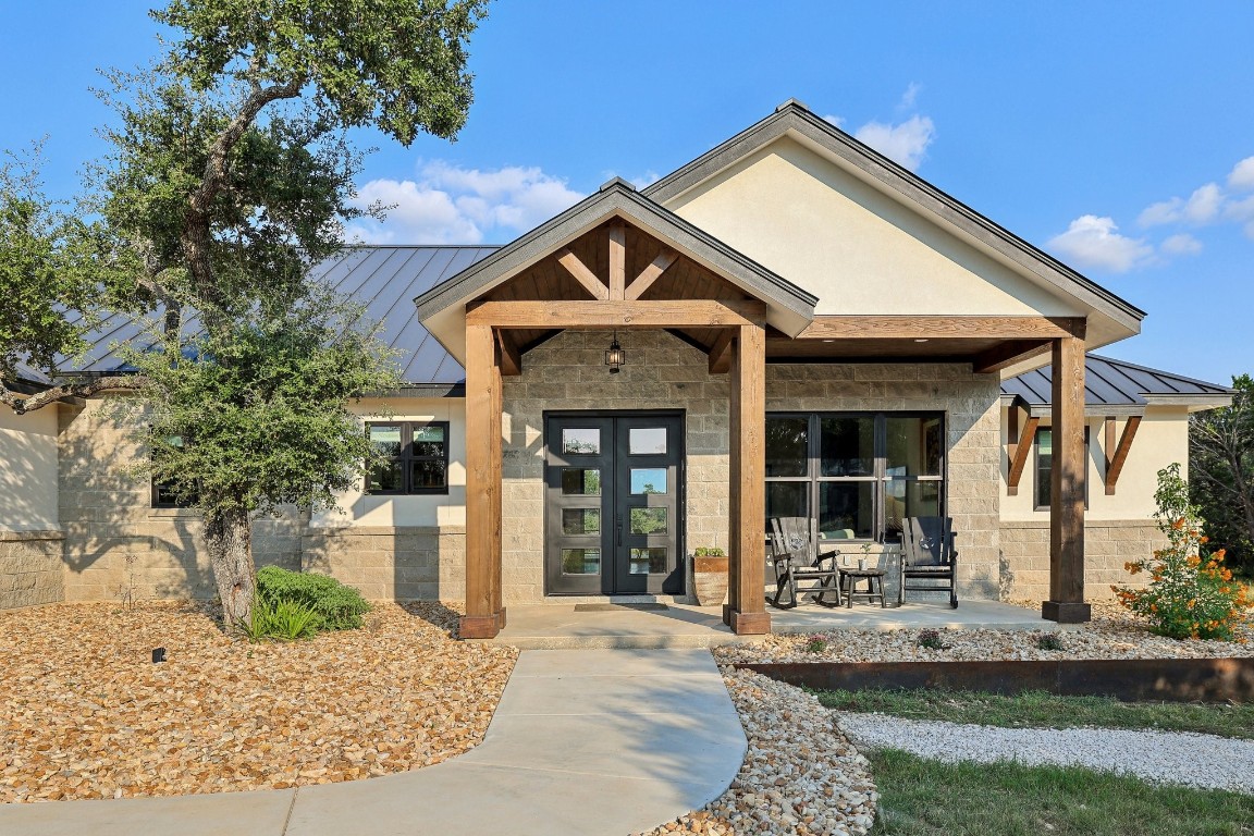 a front view of a house with garden